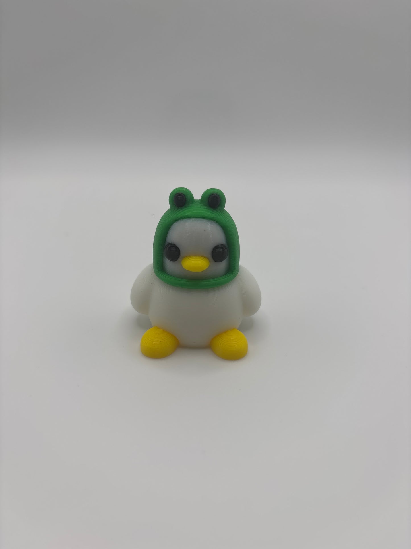 Mini Duck with frog hat